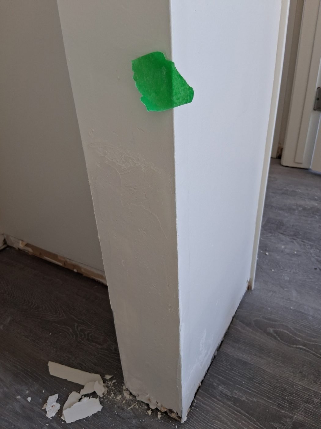 A rebuilt outside wall corner filled and floated straight