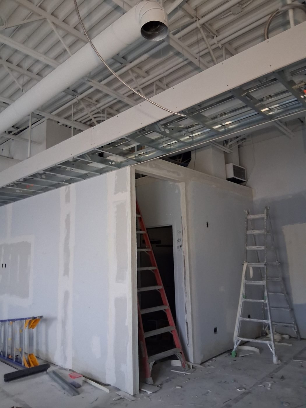 Steel stud bulkhead framing and drywall partitions in a commercial unit