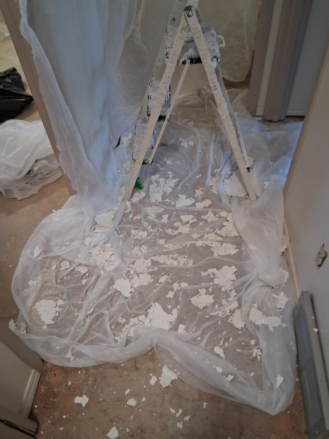 Plastic sheeting containment and floor protection on a Hampton job site