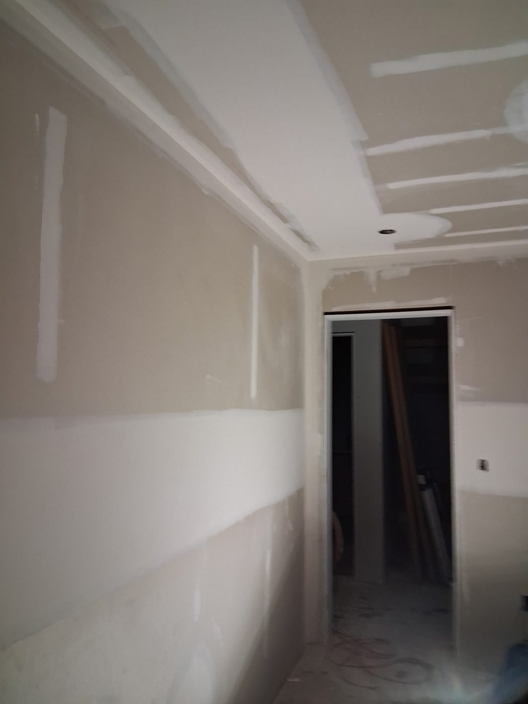 Finished hallway drywall with a cased opening