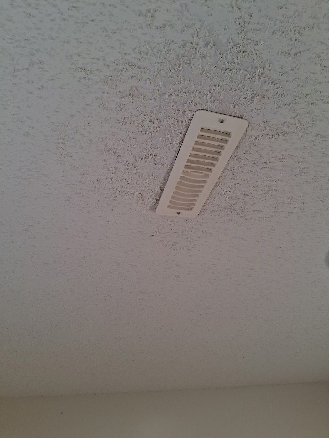 Textured ceiling with the repair re-textured and matched in